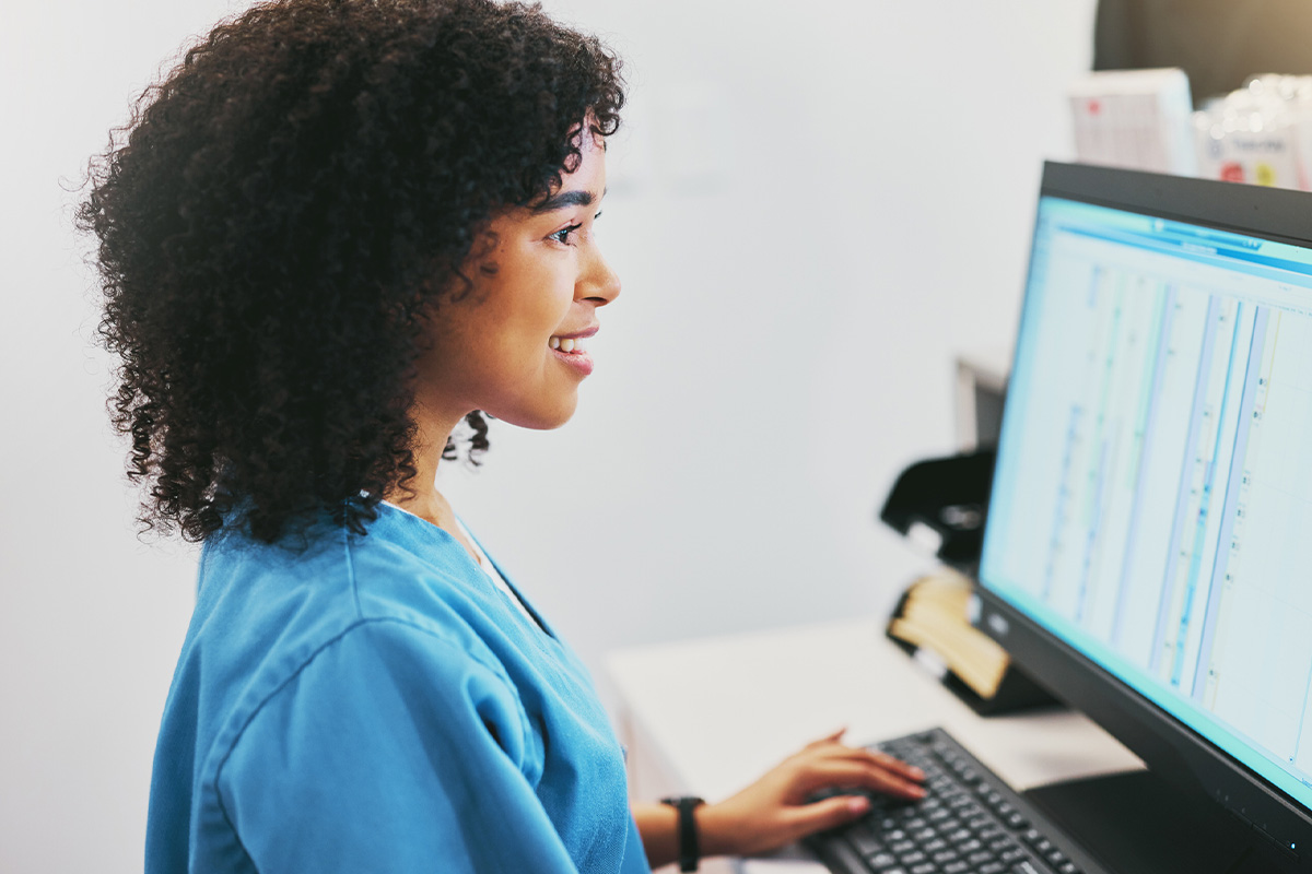 Independent Practice Partners team member reviewing CPT coding and review data for medical coding services