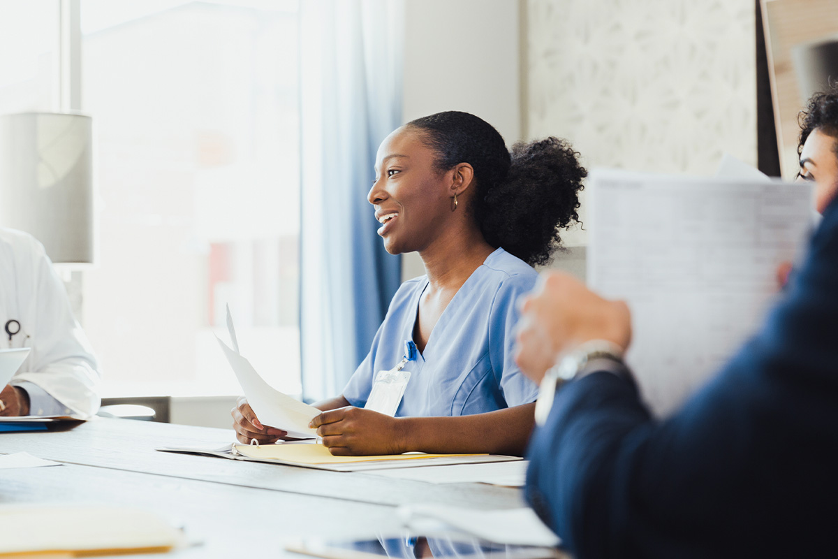 Independent Practice Partners team member discussing insurance follow-up services with healthcare staff