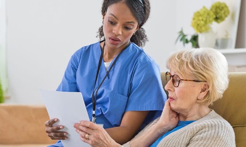 doctor speaking with her patient about the medical billing practice