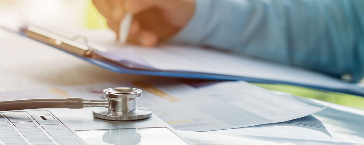 doctor reviewing his practice's medical billing process