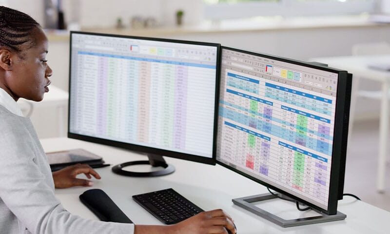 doctor reviewing medical coding on a computer