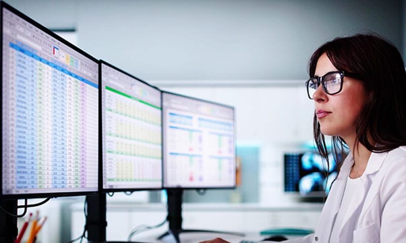 doctor reviewing the medical billing analytics data for her practice