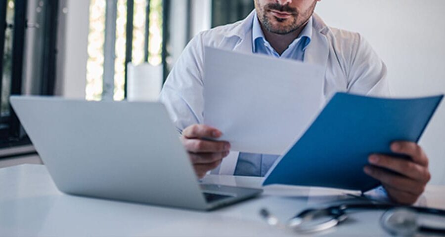 doctor reviewing the medical billing workflow for his practice