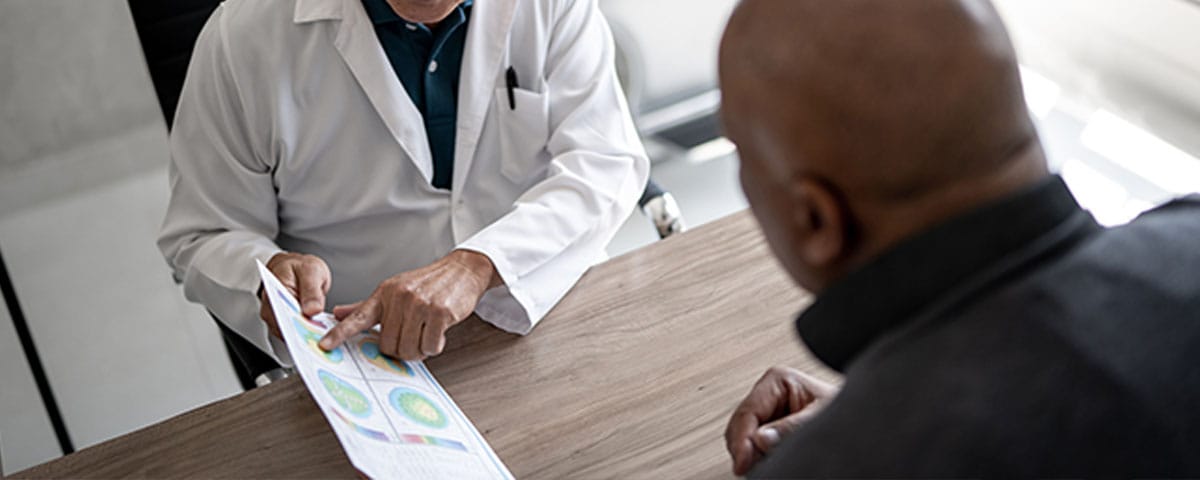 opthalmologist and patient discussing insurance and billing