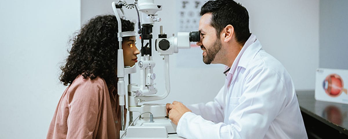 woman getting an eye exam at her opthalmologist